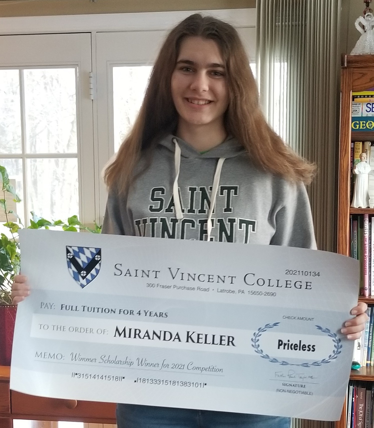 Miranda Keller with scholarship check